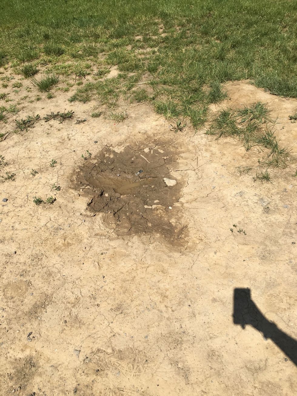 This is an example of deposition because the particles have been deposited into the pile at the bottom of the hill.