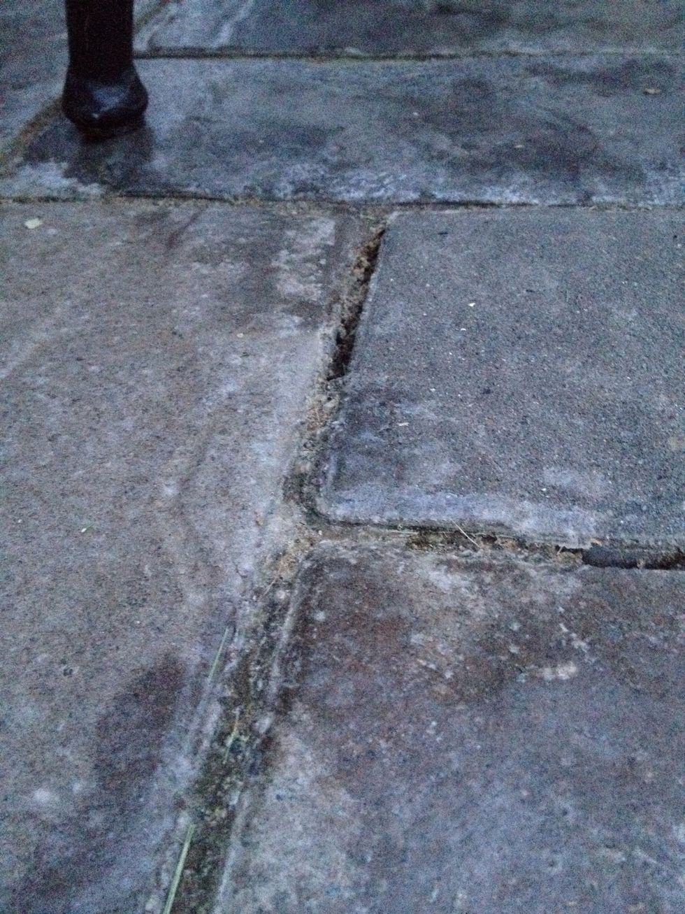 This is an example of erosion. Over time the rock has been worn down by water and has eventually disappeared.