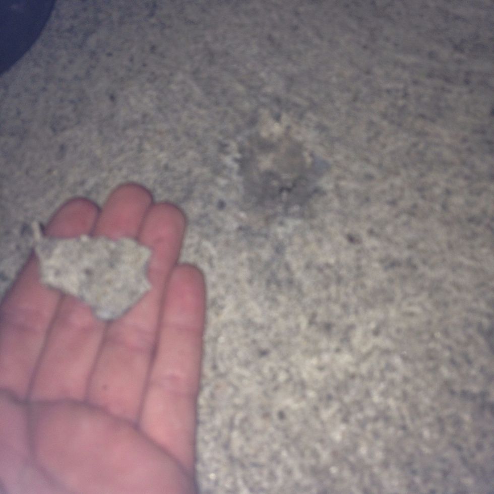 This is an example of weathering. Over time, water and weight constantly falling and pressing on the sidewalk caused it to break into smaller pieces than its original form.