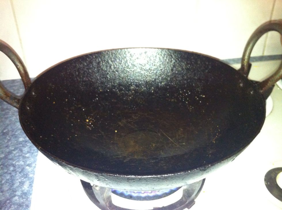 This is called an "appachetty", kadai, or appam wok. This needs to be well seasoned before preparing this pancake. A lid for this wok is also essential.