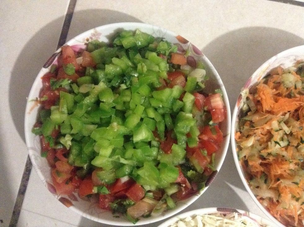 This is called 'pico de gallo' or 'chismol'. Diced tomatoes, onions and green pepper; all in equal parts. Add some coriander, salt and lemon or vinegar.