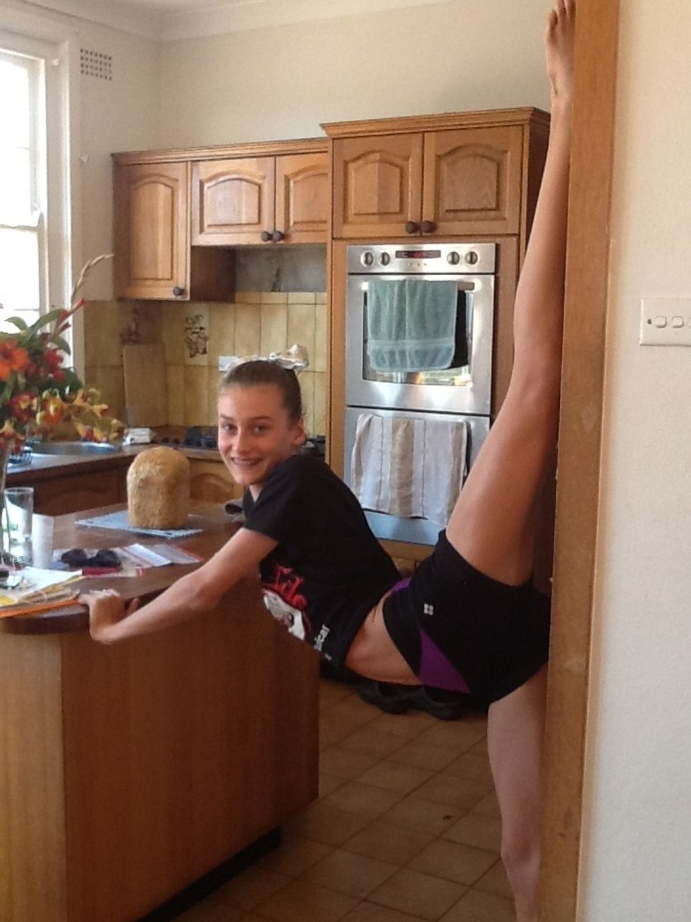 This is called wall splits. This helps stretch your back and legs.