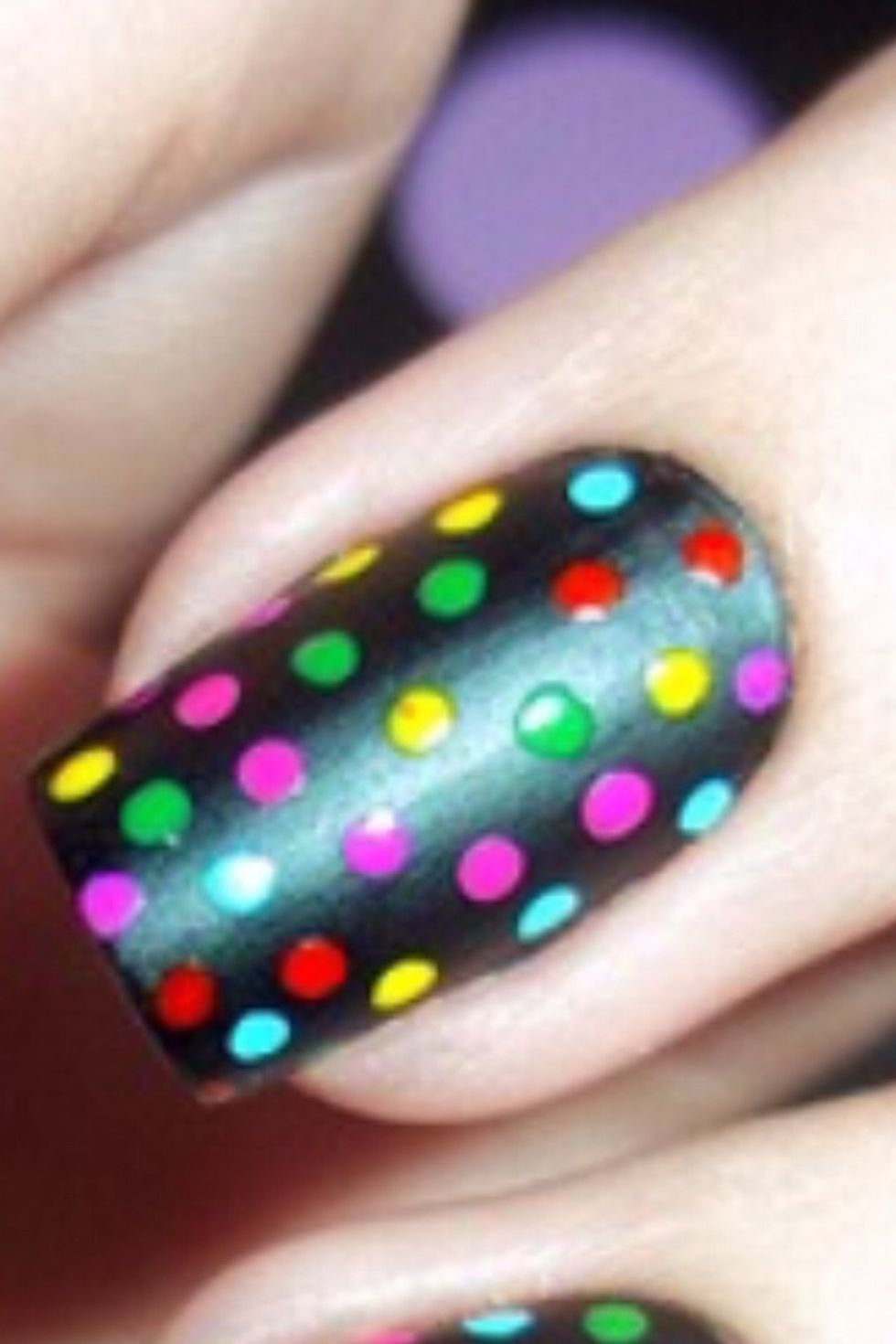 This is cool it's black nails with coloured dots