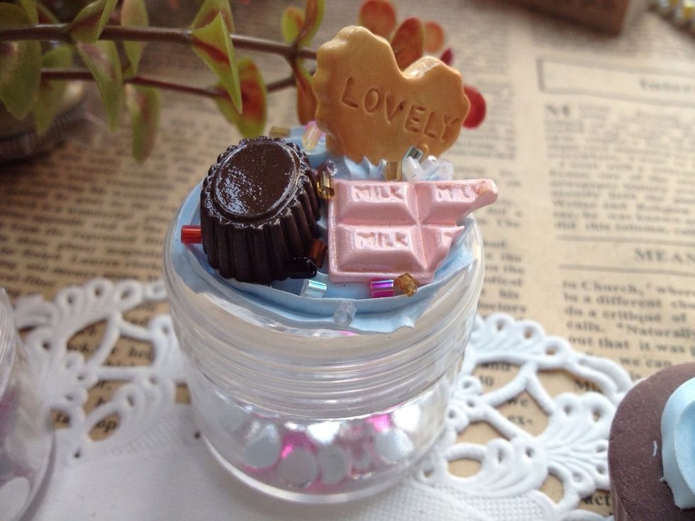 This is decorated with food theme resin cabochons.