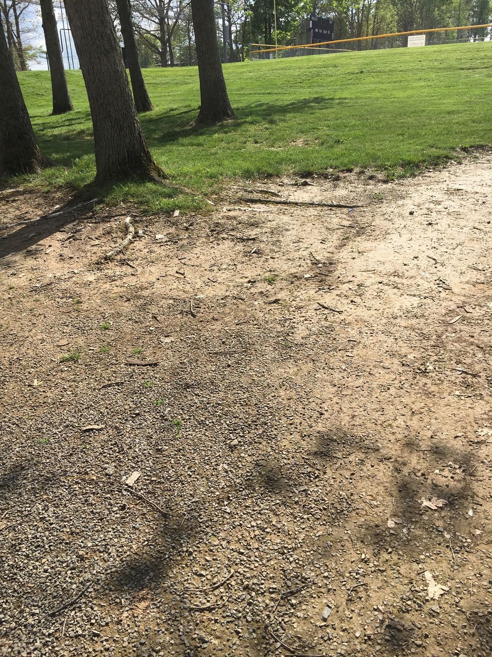 This is erosion because there used to be more land there but it was carried away and now the land is not level.