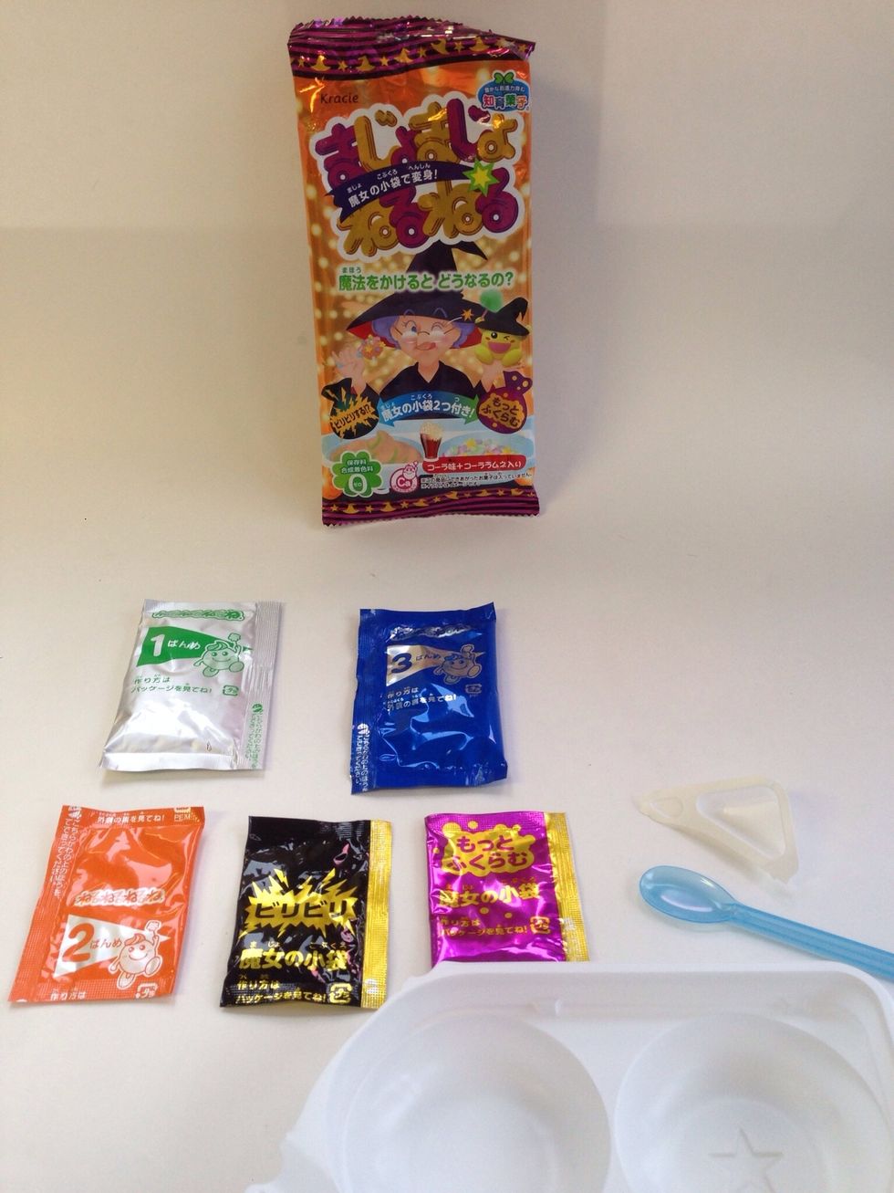 This is everything that comes in Kracie's Majo Majo Neru Neru Cola Lemon DIY Candy Kit