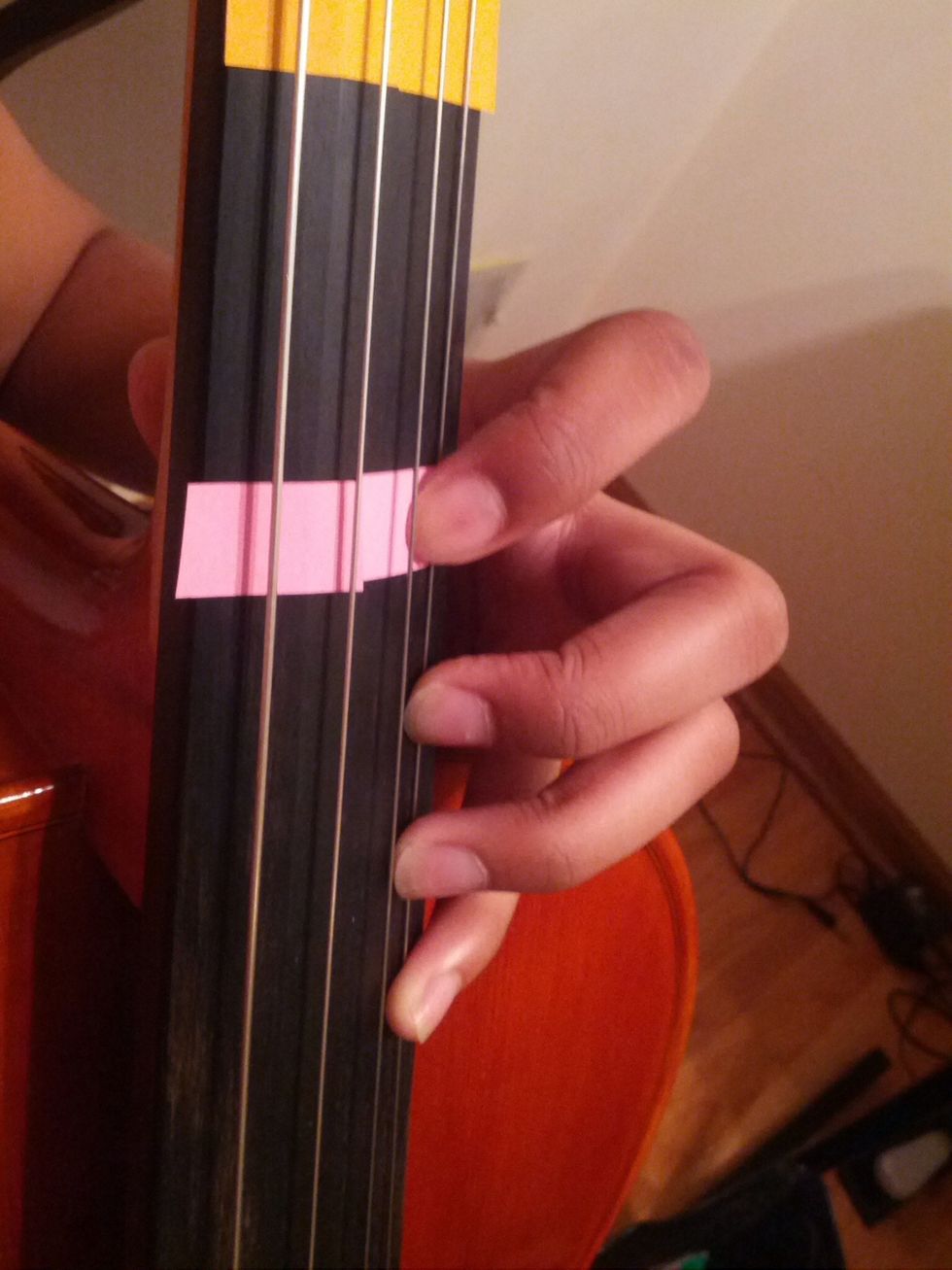 This is fourth position. The easiest way to get to this position is if you just drop your first finger all the way down until your thumb is stopped by the "neck" of the cello.