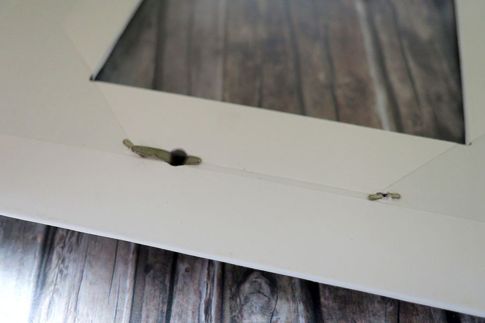 This is how everything will look like on the back side. The tales of the brads and the knob will not be completely flat.