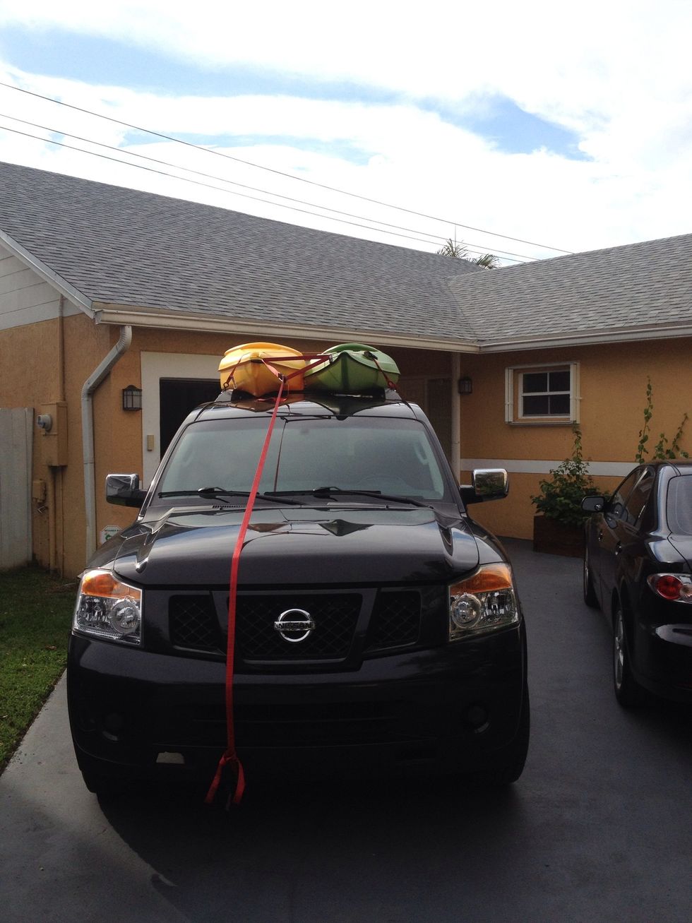 This is how I use to strap my kayaks to the roof of my truck. The problem is, the strap coming down over the bumper was rubbing and was going to mess up the paint