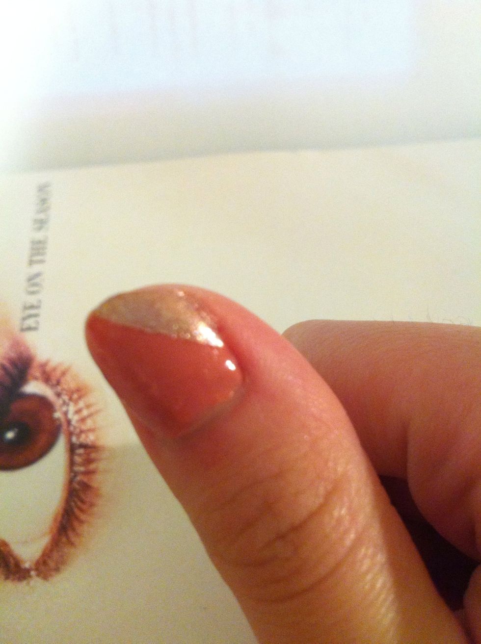This is how it look after peel off the tap. You can stop on this step and apply the top coat to finish off your nail. Or you can continue and do the other side.