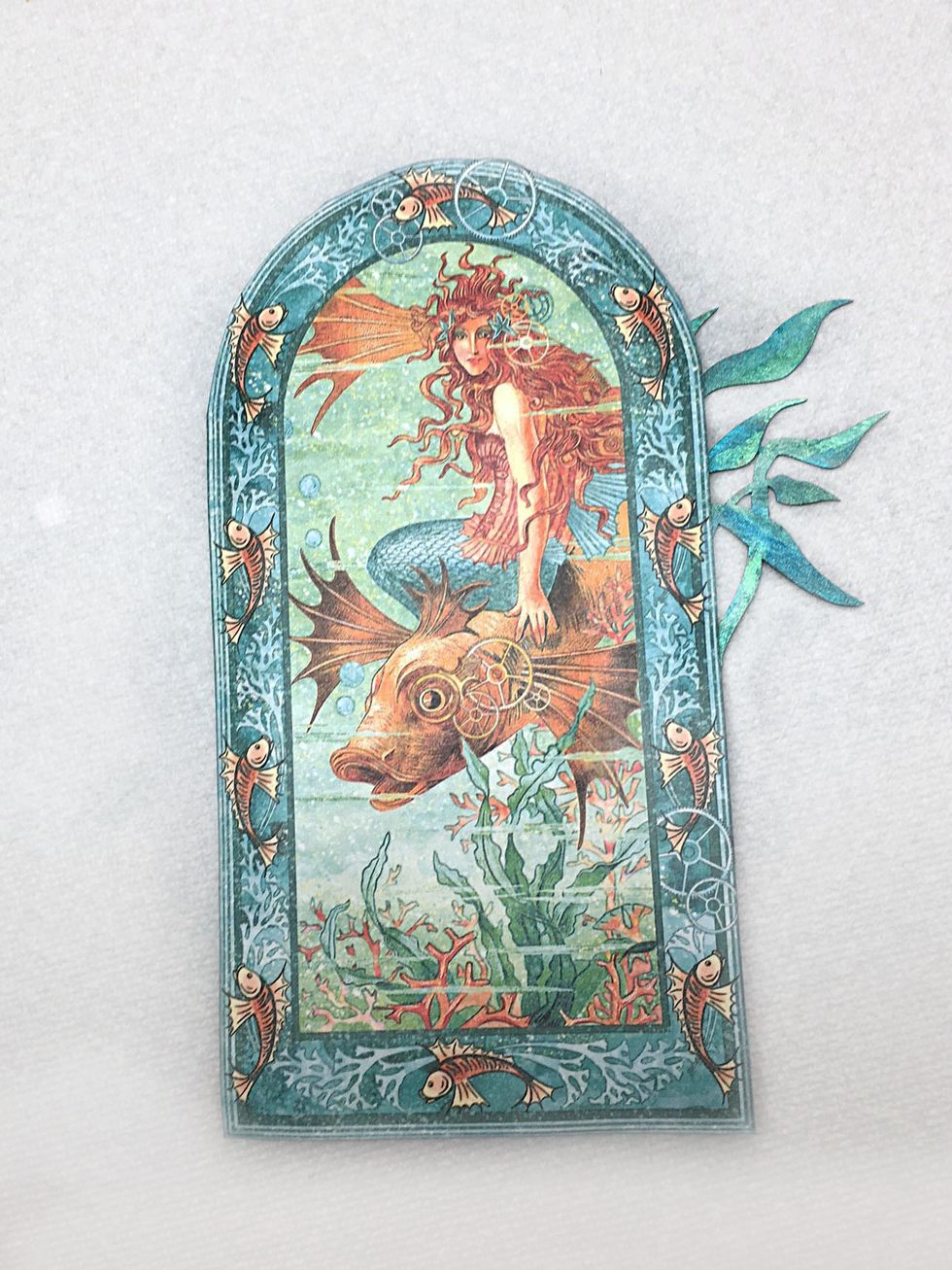 This is how it should look before adhering to the front of the mini. Add a coat of matter medium to protect the paper.