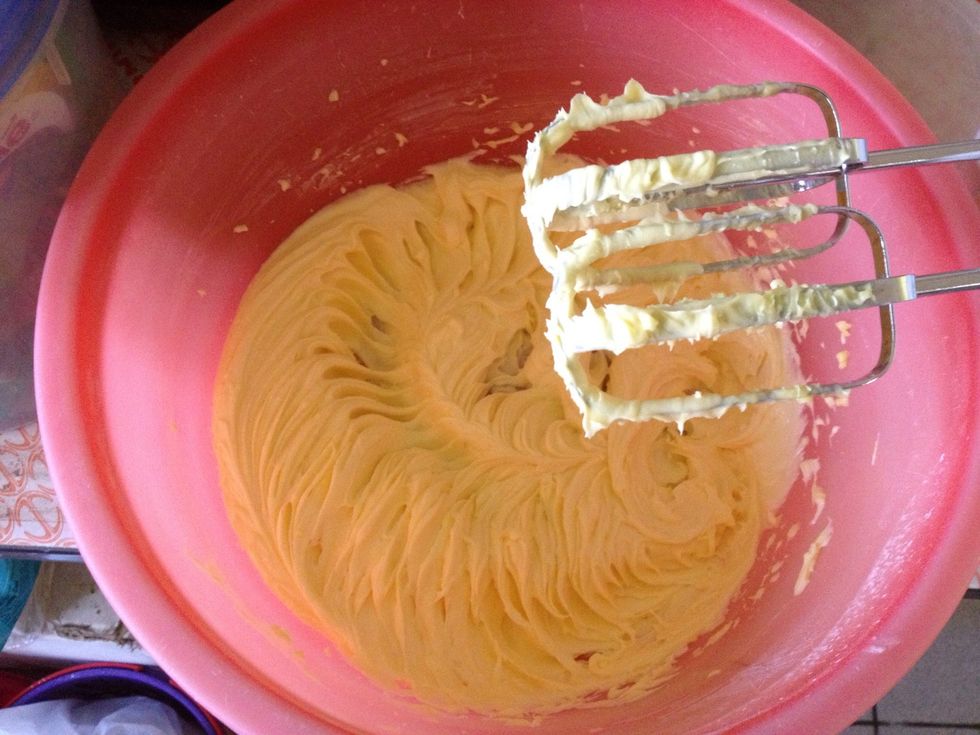This is how it should look like. Creamy but the butter colour does not change much after the beating.