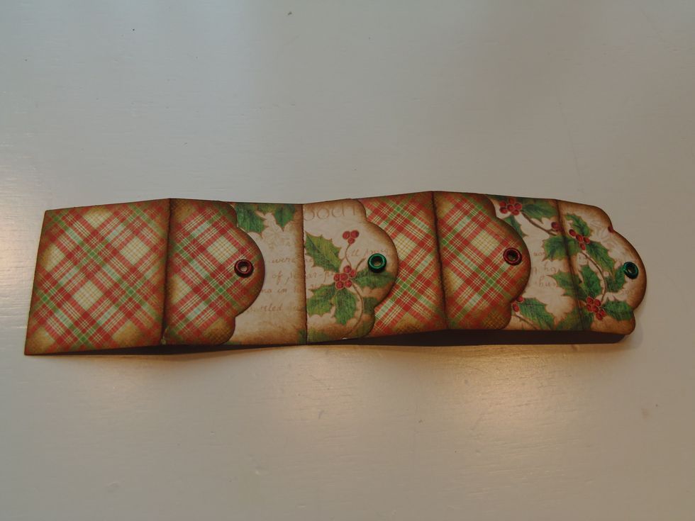 This is how it should look like.  To shape into a box,  glue the two ends together.  Just like the rest, apply glue only to the top sides of the tag.