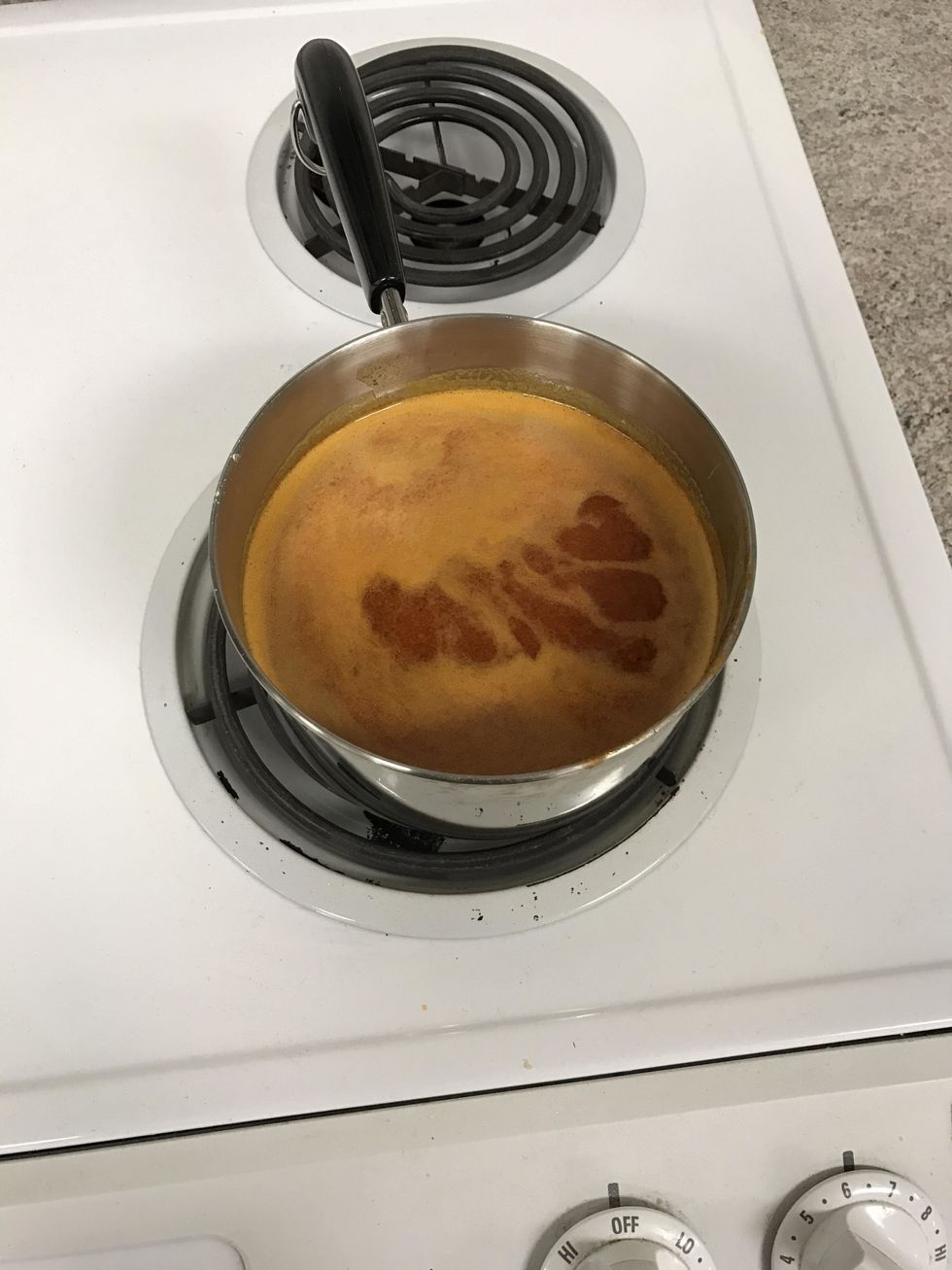 This is how the sauce should look while it is simmering and after all of the ingredients are melted together. The pot is faced inward.
