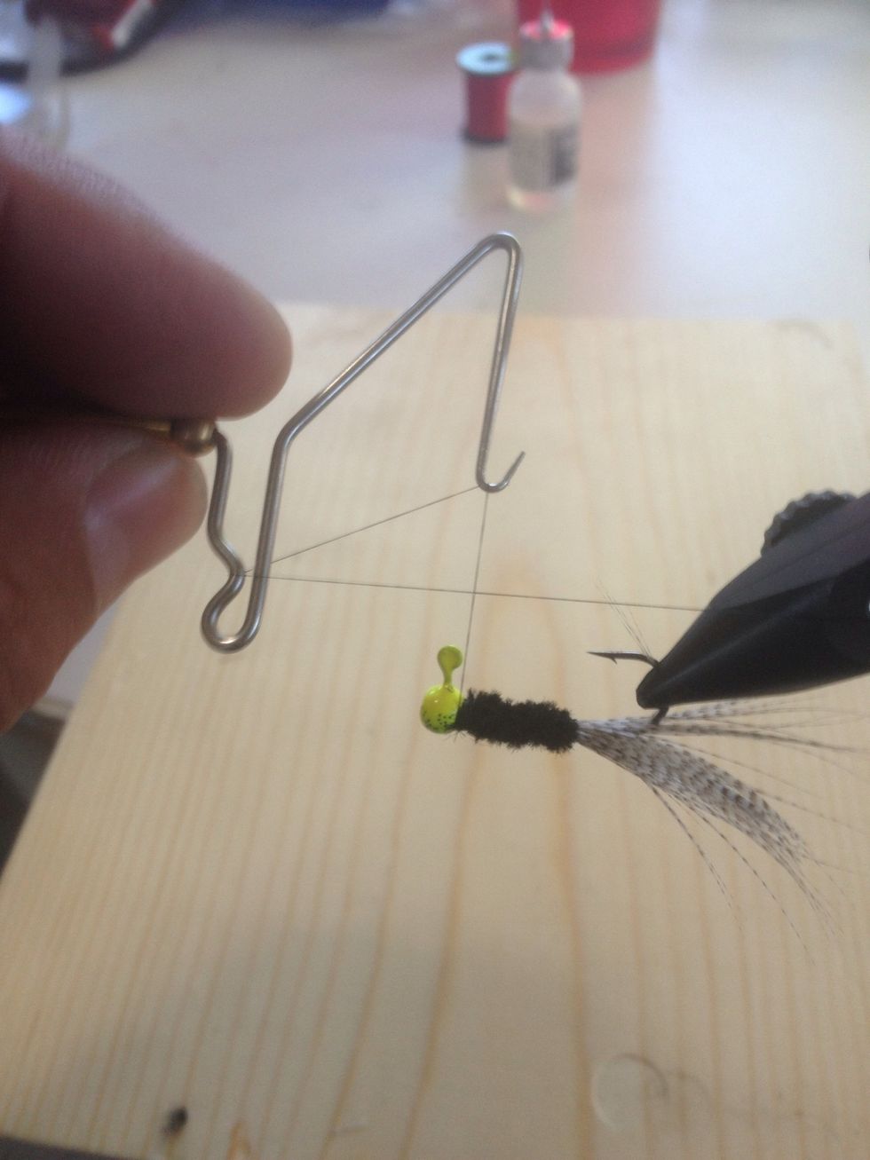 This is how the whip finisher is placed. Like a number 4. You can also tie 3-4 half hitches to secure this.