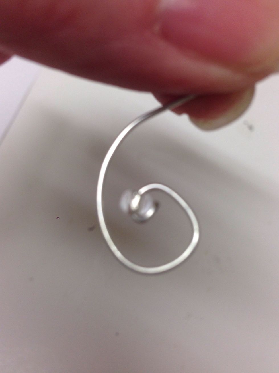 This is how the wire will look with the first bead put in place.