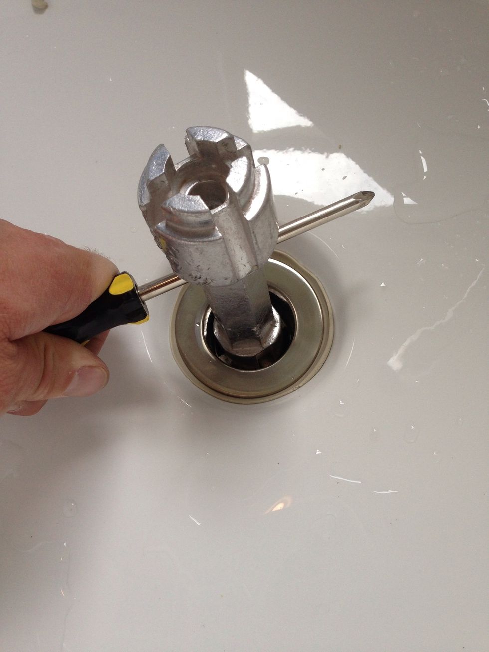 This is how you use the screwdriver in the tool as a handle as for extra torque.