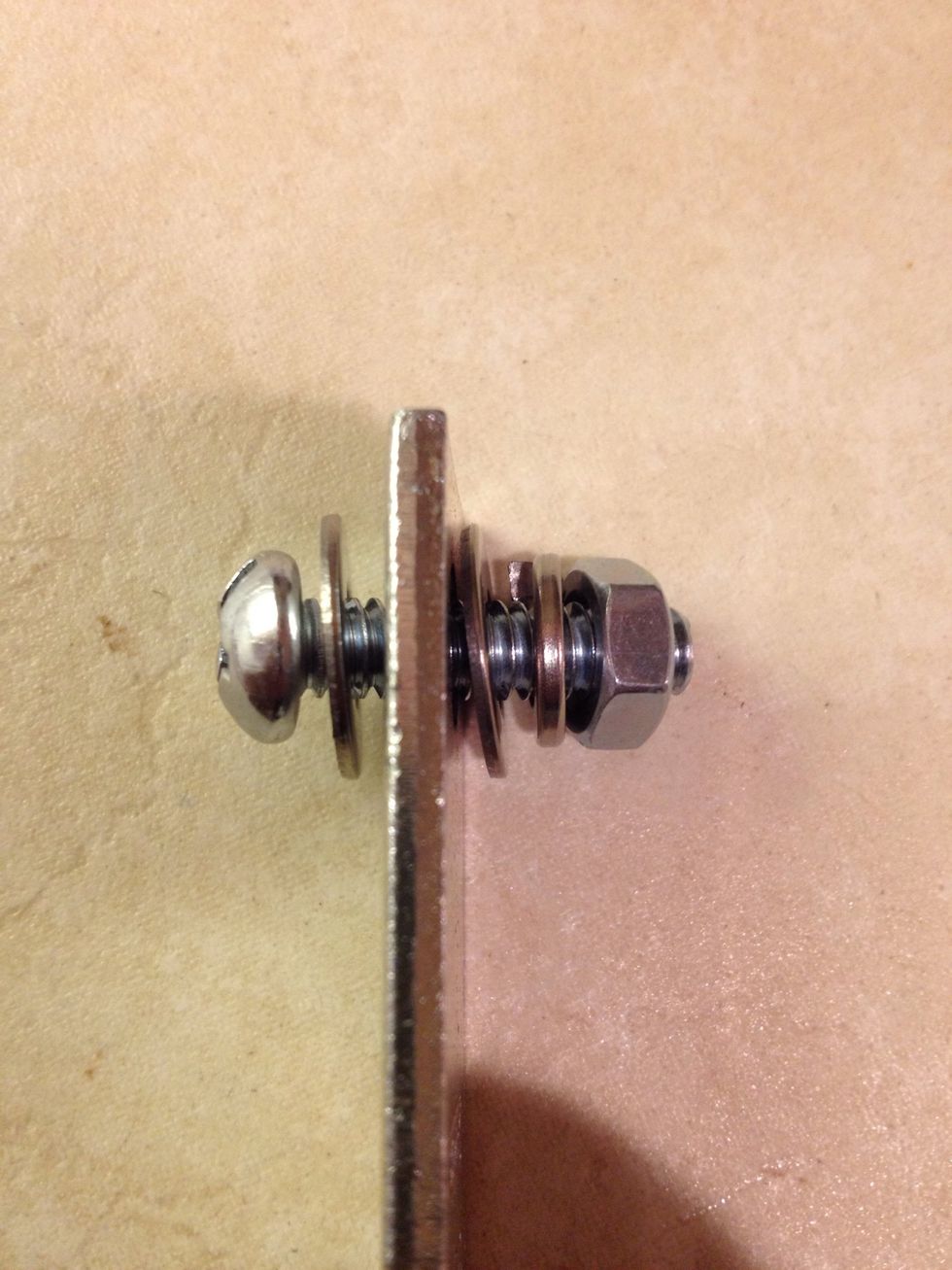 This is how you will arrange the washers and nut with respect to the bracket. Inside the cabinet there will just be the bolt head and the first flat washer.