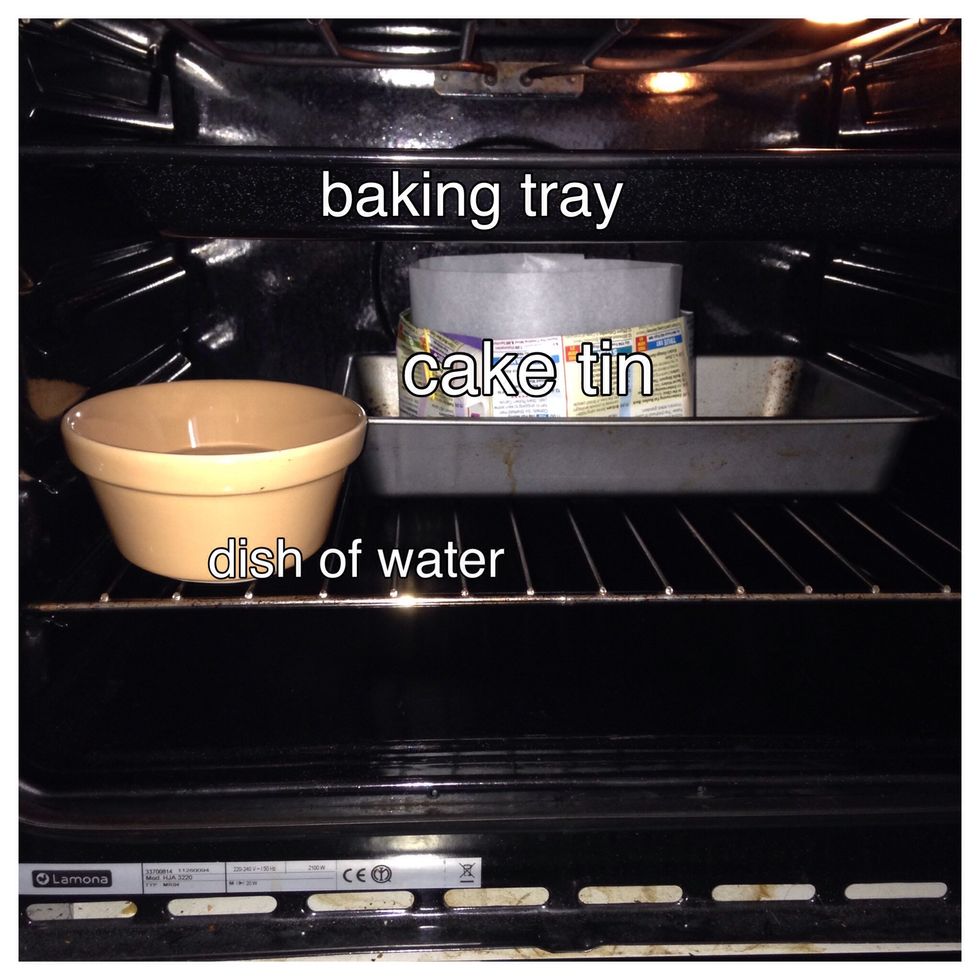 This is how your oven should be set up. Position your cake tin in the middle of the oven. I always use baking tray to put the cake tin in. It is easier to handle.