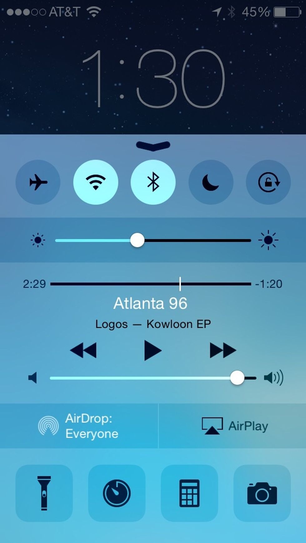 This is iOS 8. Note the control center icons have a different enable/disable state. When you select Wifi, Bluetooth, etc the background turns white. It's much easier to tell what's selected now!