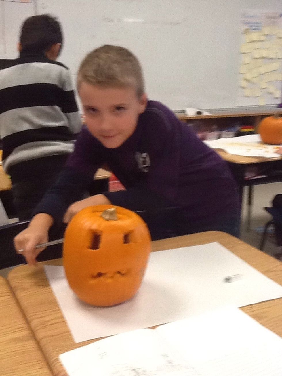 This is konnor and his pumpkin.