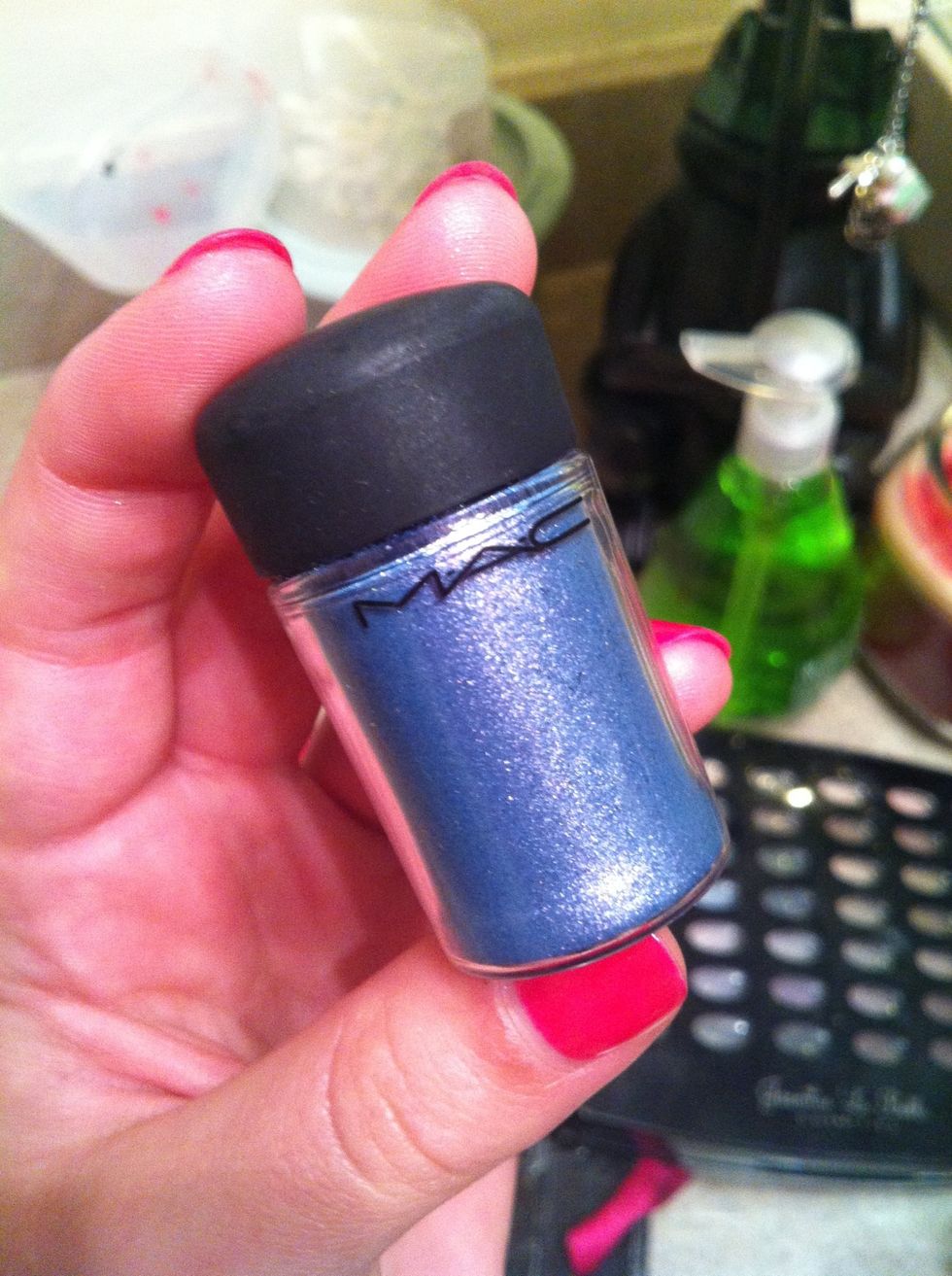 This is Mac's shadow called "Cornflower" and I am applying this to the contour area to add more beautiful sparkle to the eye. This shadow or any sparkly blue shadow will work.