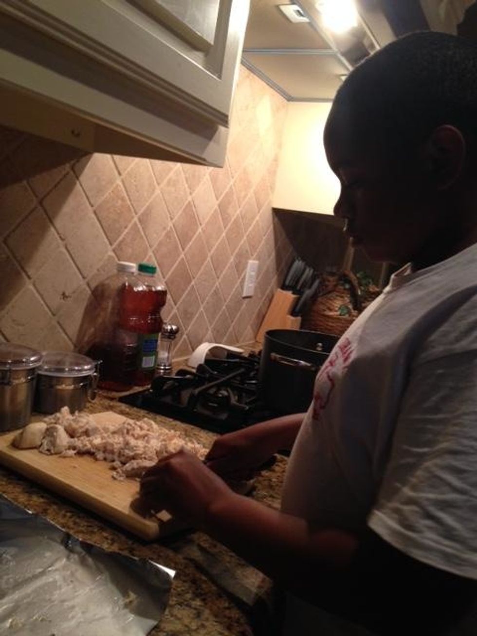 This is me cutting the chicken after I boiled it.