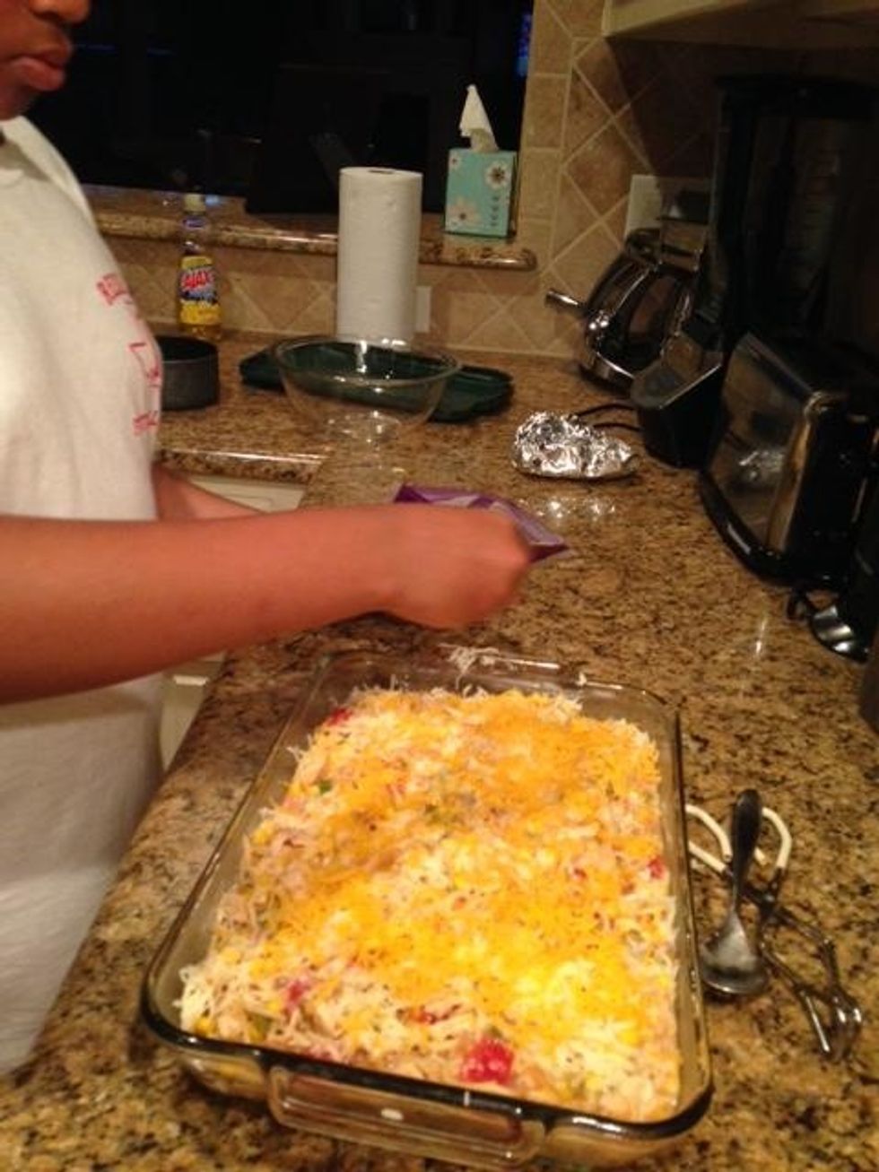 This is me sprinkling cheese on the spaghetti.