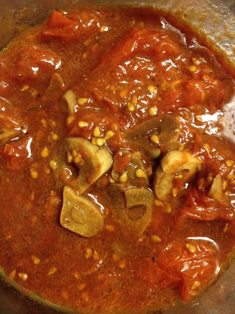 This is my balsamic garlic tomato sauce I made previously. Halves your tomatoes, drizzle balsamic vinegar and crushed garlic, bake at 325 for an hour. Crush with a potato masher to make a sauce.