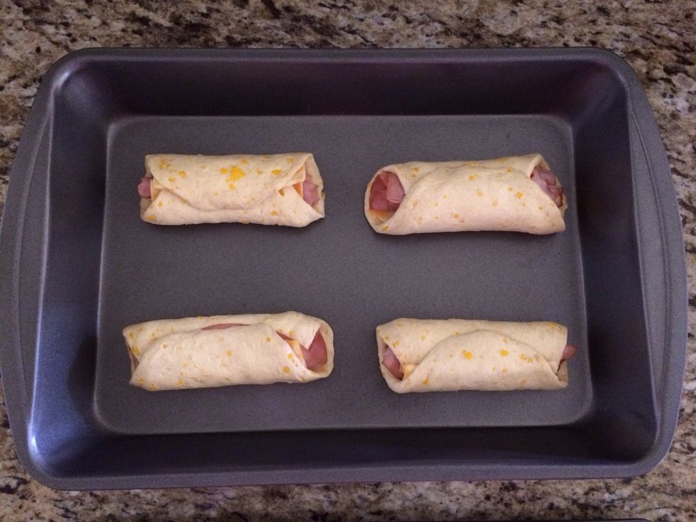 This is my burrito more clean version. Flatten the biscuit, place ham and cheese...then roll it.