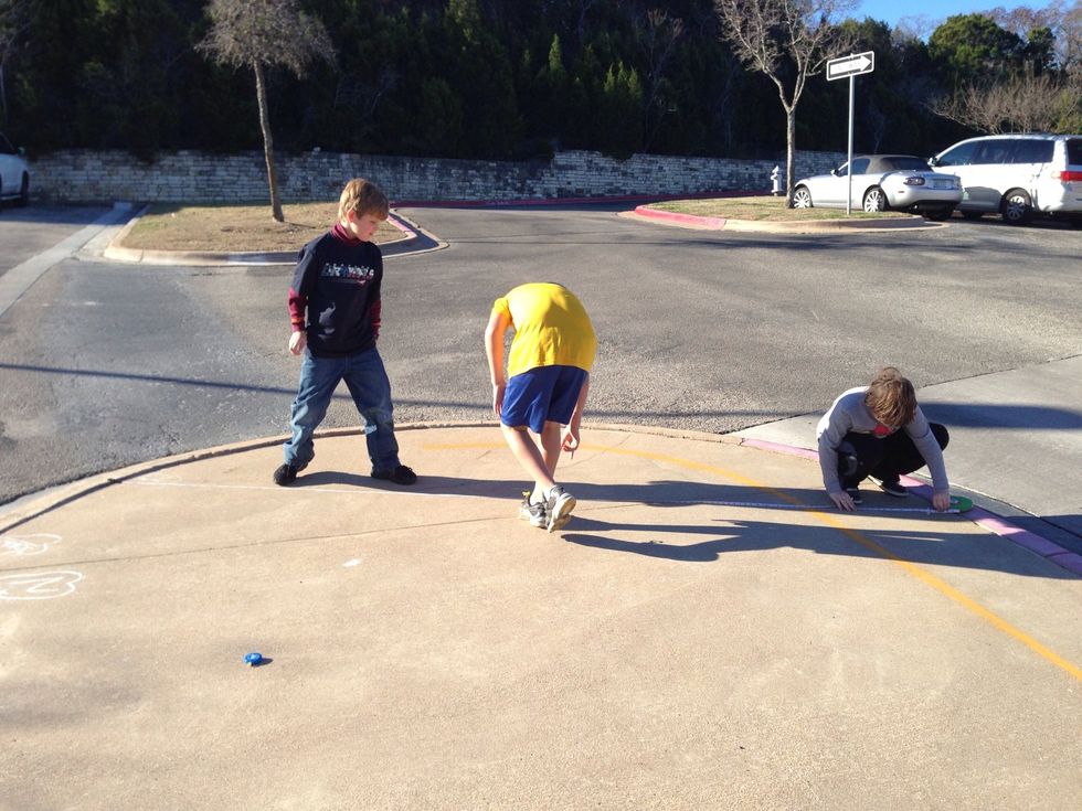 This is my classmates doing the experiment I believe that early in the day the shadow is long then the time around noon it is a shorter shadow then letter it gets longer again then it goes sideways !