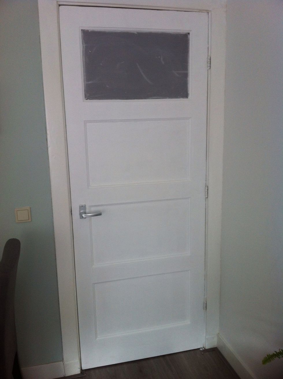 This is my door before the decoration. Didn't like the plastic at the top. Measure the distances of the surface where you want to put the self-adhesive paper.