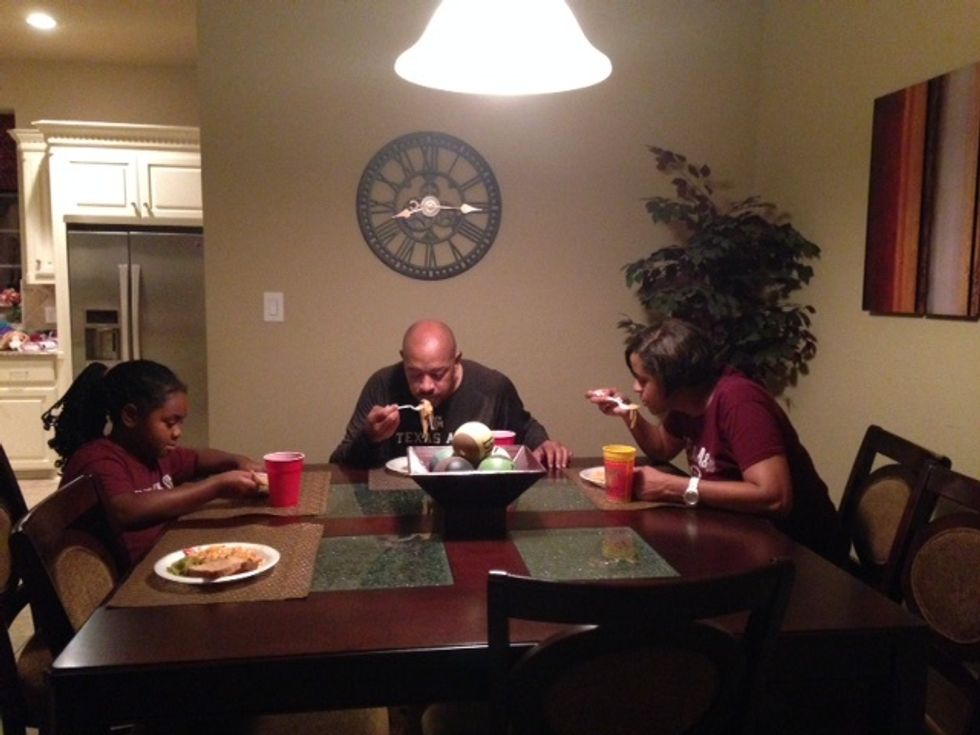 This is my family eating the meal that I prepared.
