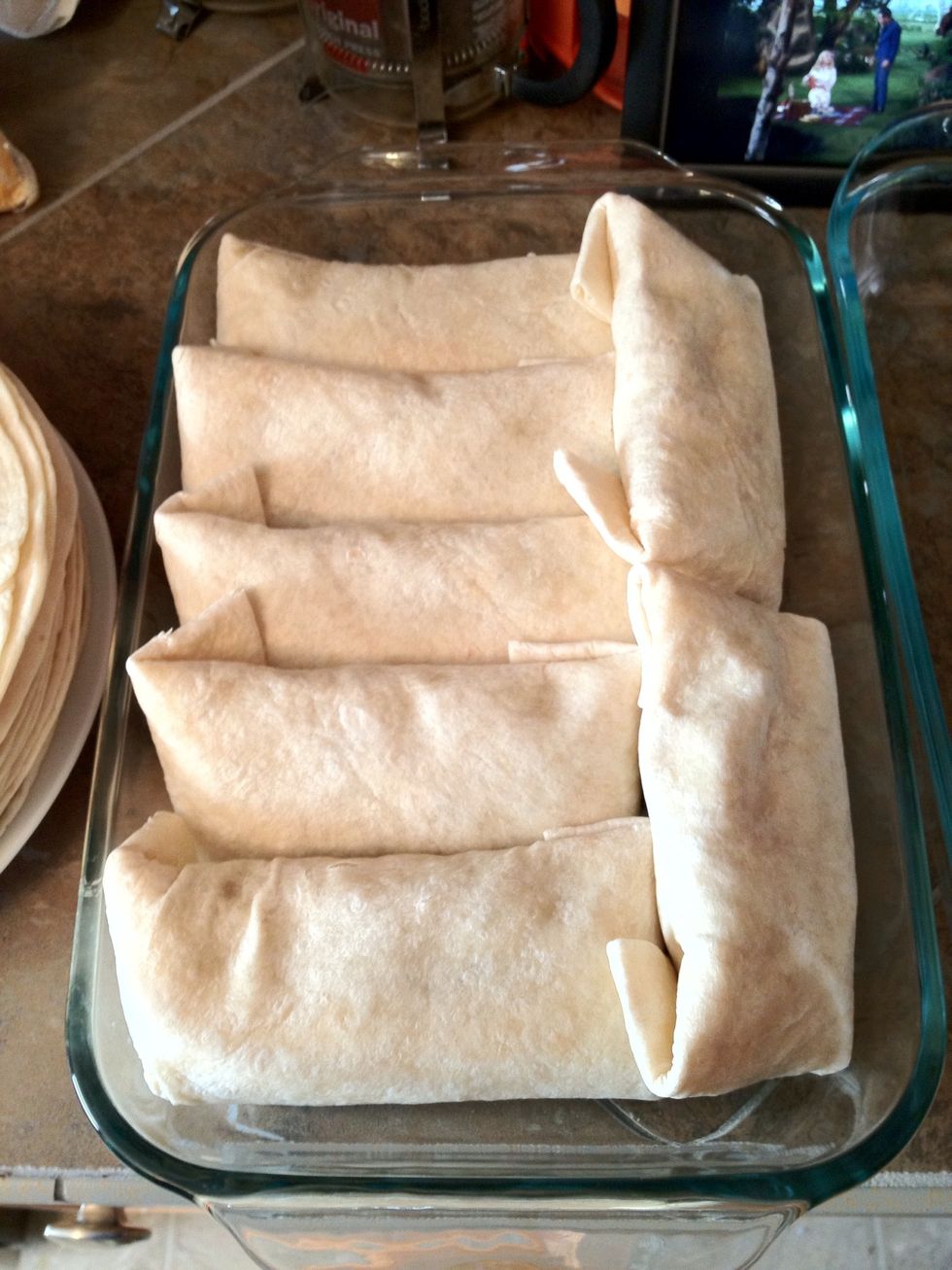 This is my layout that fits 7 to a pan. When you finish your first pan, turn the oven to 400 degrees F so it has time to heat up while you wrap the rest.