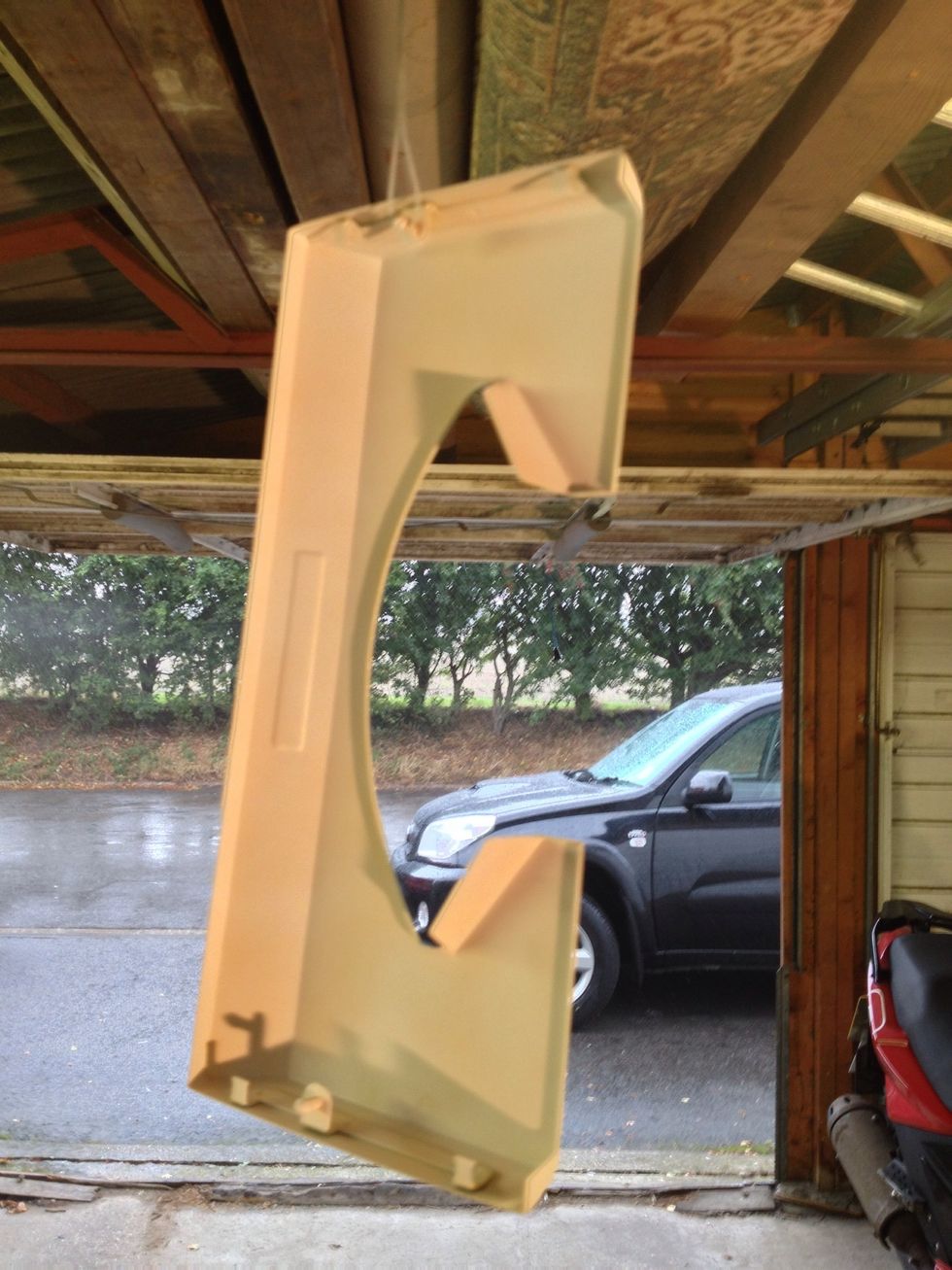 This is my top panel hanging up after it's first coat of white primer. It's best to place the can in a jug of warm water for a little while first before spraying. Follow the instructions on the can.