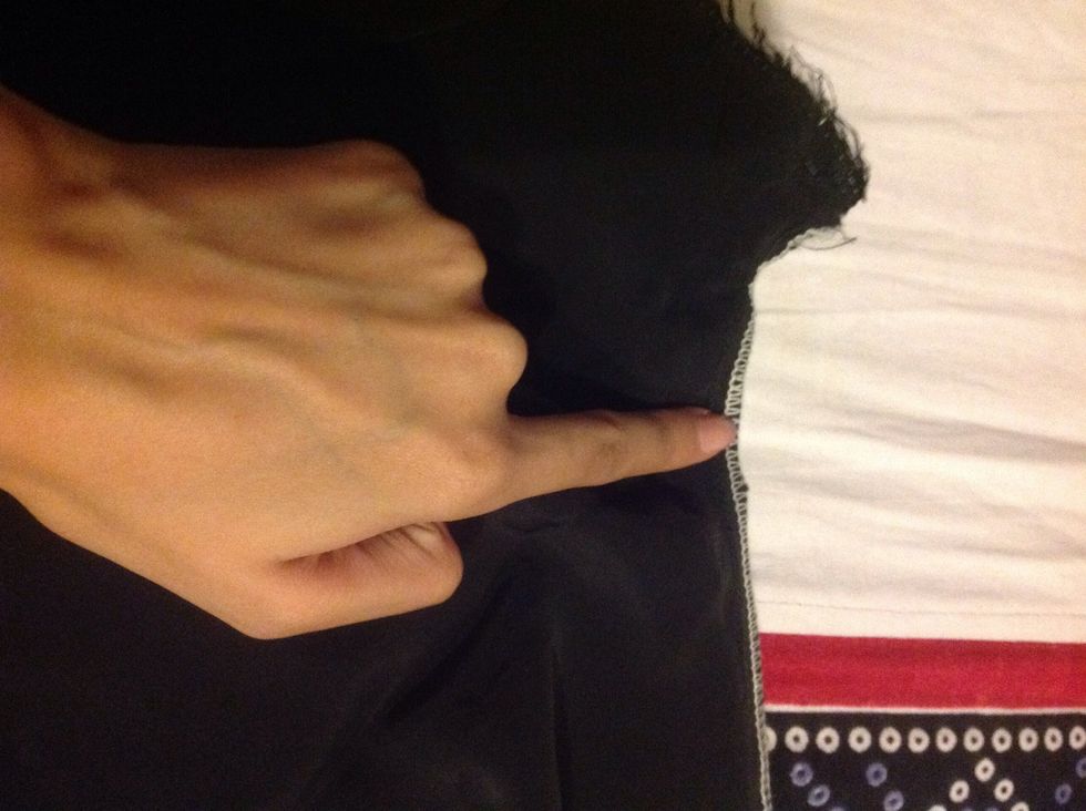 This is on the other side of the pant, you need to get rid of the curved stitches on this side too. My finger marks till where I wants open my stitch.