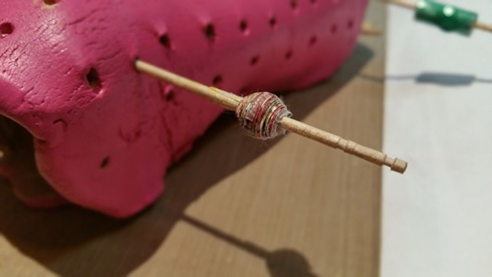 this is one of my paper beads before I've applied an Prisme Fantasy paint