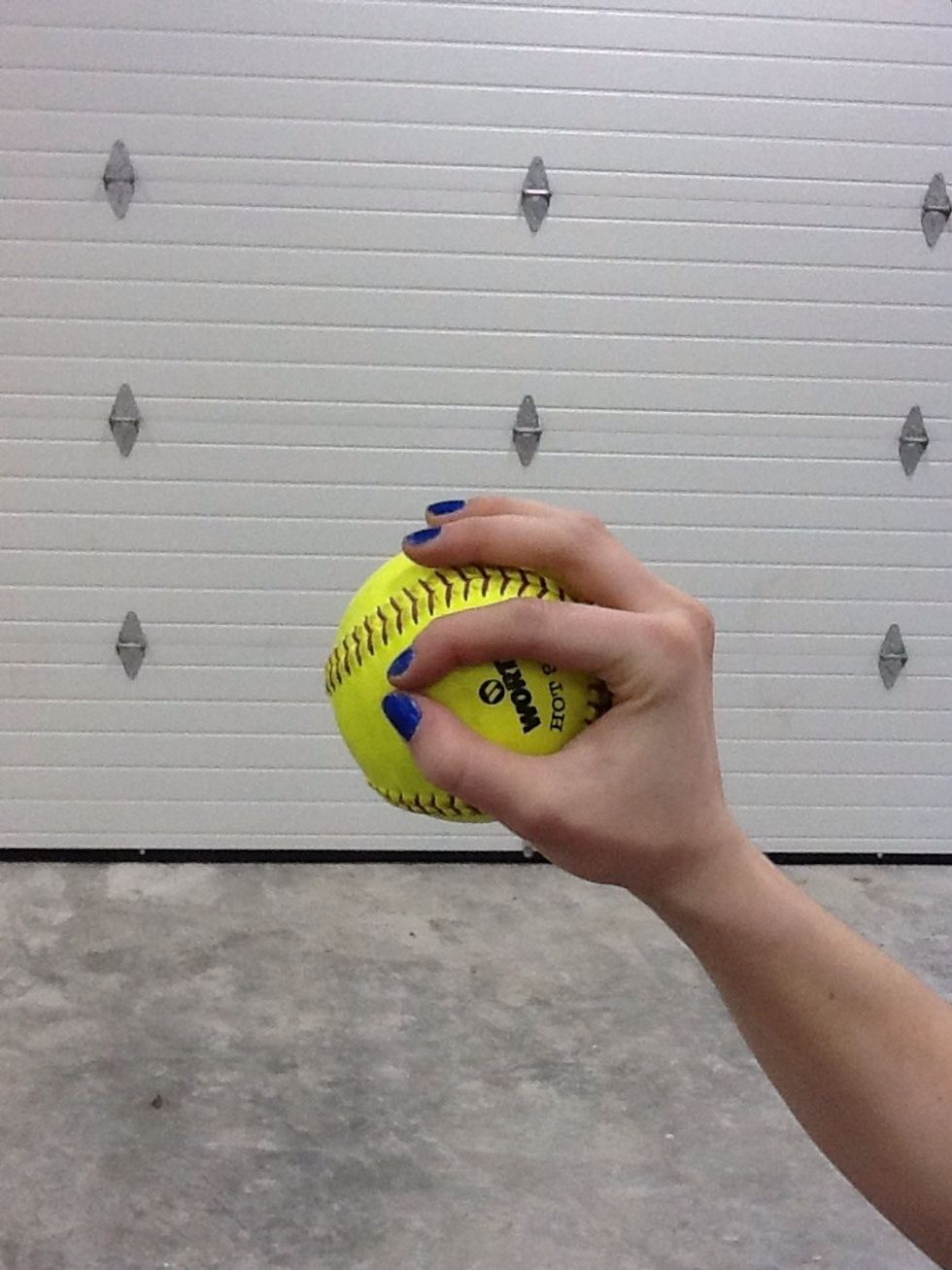 This is one of the many grips for throwing a change up. This is called a "circle change". You should be cupping the ball in the palm of your hand. No pressure should be applied from the fingertips.