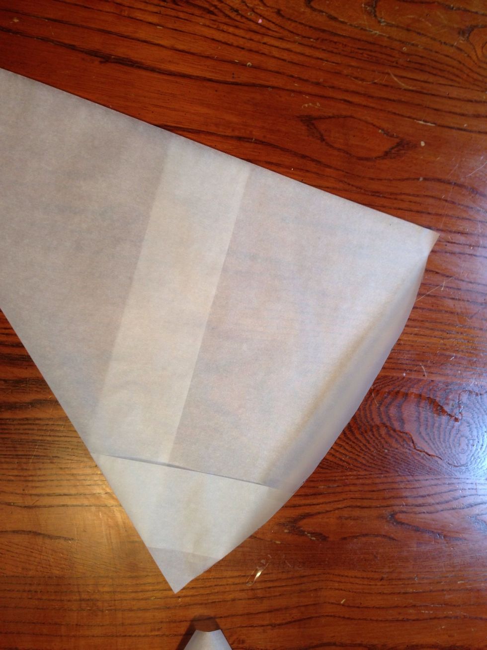 This is optional. You only need to do these next few steps on the pattern if you want a scalloped look. Fold the pattern in half.