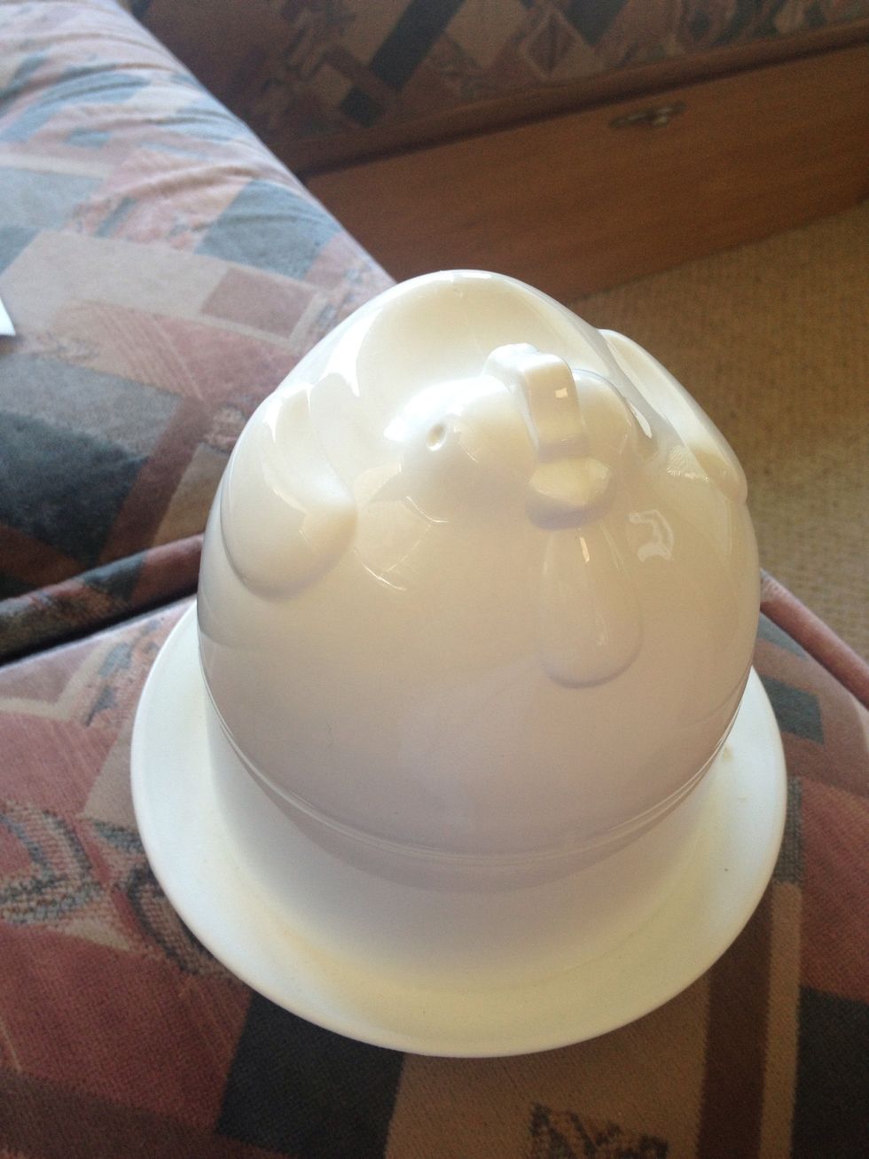 This is our egg boiler. It's shaped like a chicken. It came with our caravan so I don't know where it's from or who it's made by.