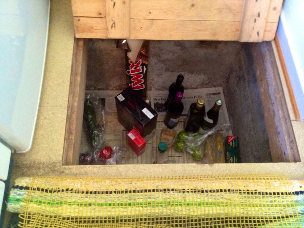 This is our hole/pit in the kitchen floor; The kitchen is equipped with this "facility". The house is built in 1935 and back then there was no electricity inside. The pit keeps the goods semi-cold.