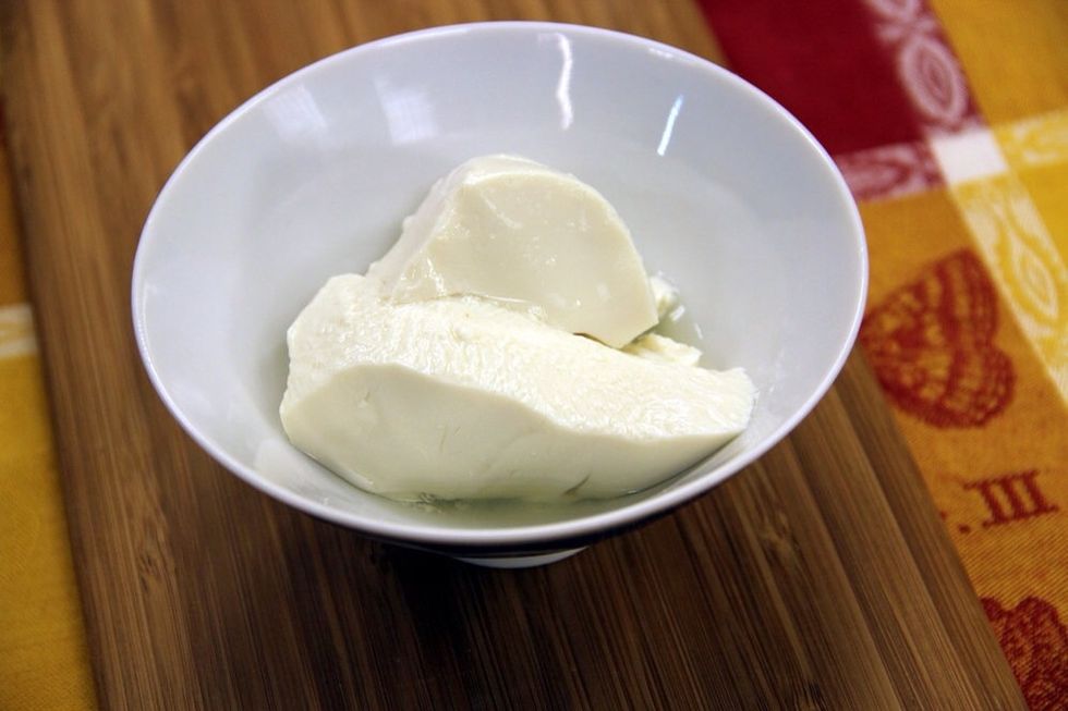 This is silken tofu which contains much of its original liquid.