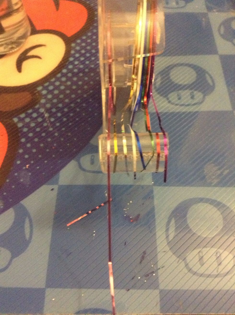 This is striping tape, or nail tape. You can get a ton of rolls off Amazon or eBay for a really low price.