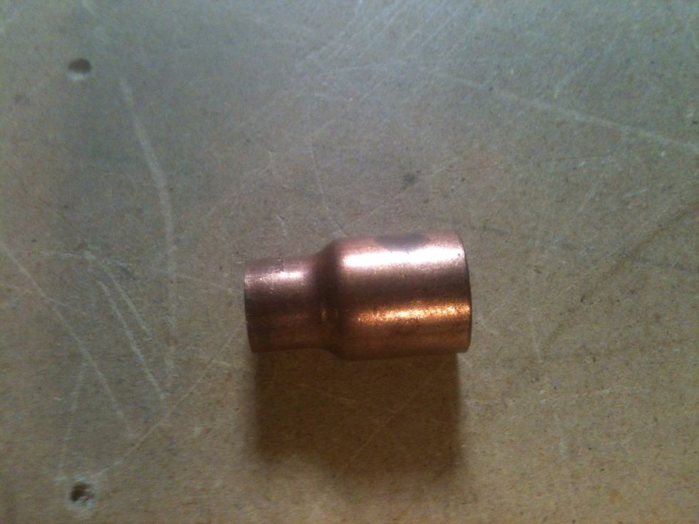 This is the 1/2"-3/8" reducer. The 3/8 side will go into the hole you made in the top of the canister.
