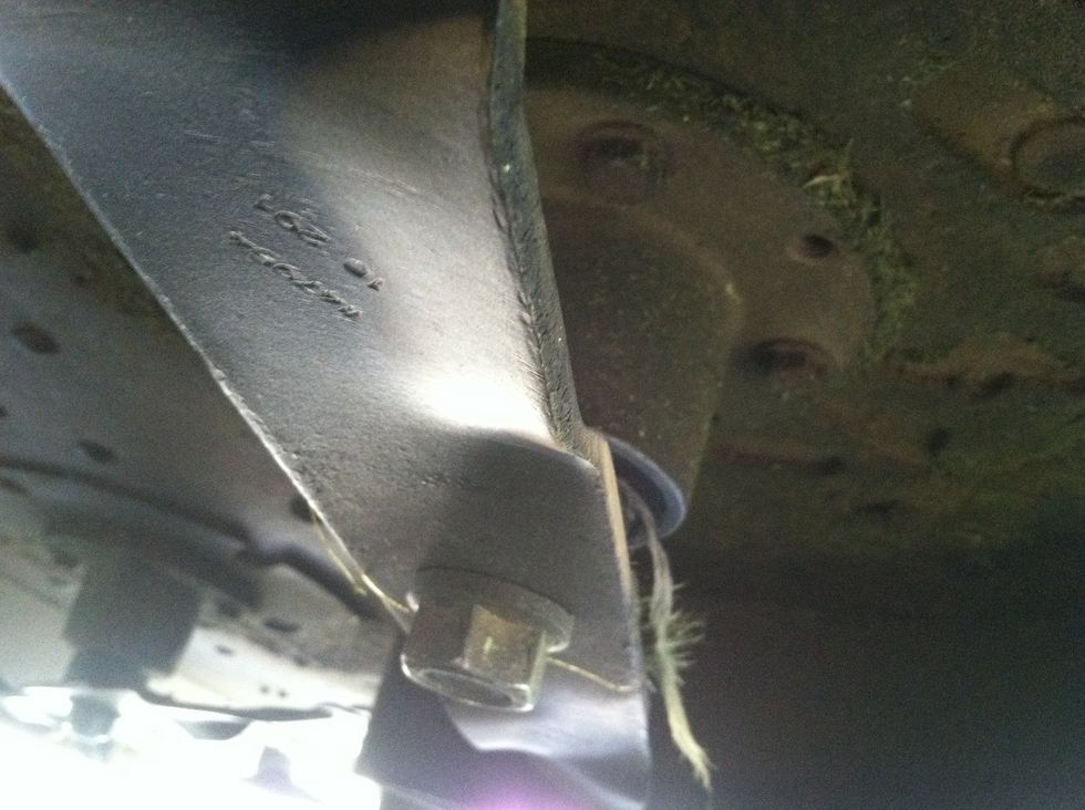 This is the bottom of the bolt, not a great picture, but the item at the bottom left center location is the nut that holds the blade in place