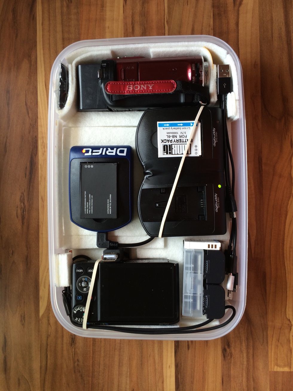 This is the box after, housing my photo & video cameras, chargers for them and my Drift Ghost-S action cam, 3 batteries per device, a spare USB-port and a 12Ah USB battery below for charging on the go