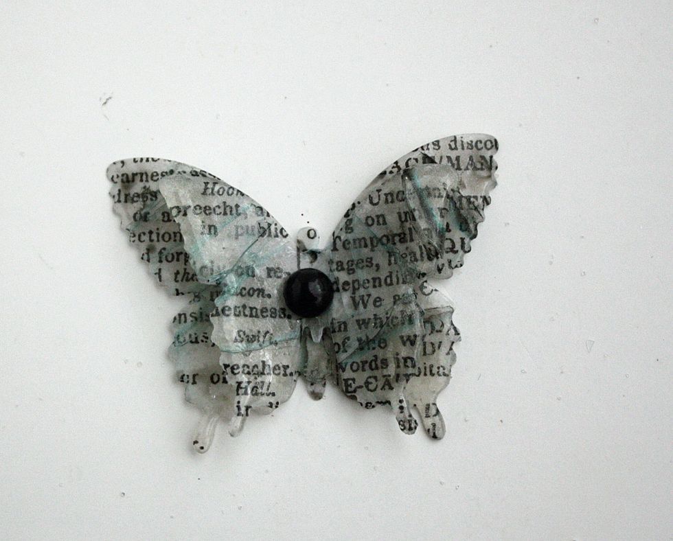 This is the completed butterfly. I layered the different sized punches with hot glue. For the finishing touch I added a flat back adhesive pearl.