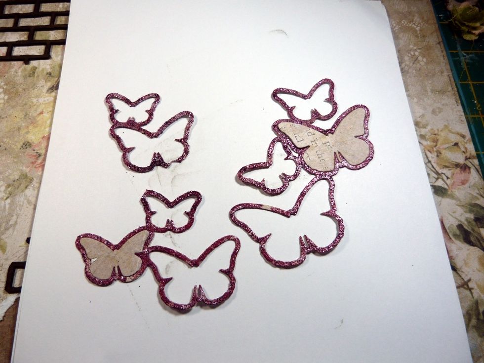 This is the Die of the Month. I embossed it with the BFS embossing powder 'Magenta' and then cut into 3 pieces. I left 2 of the butterfly pieces left in the frames.