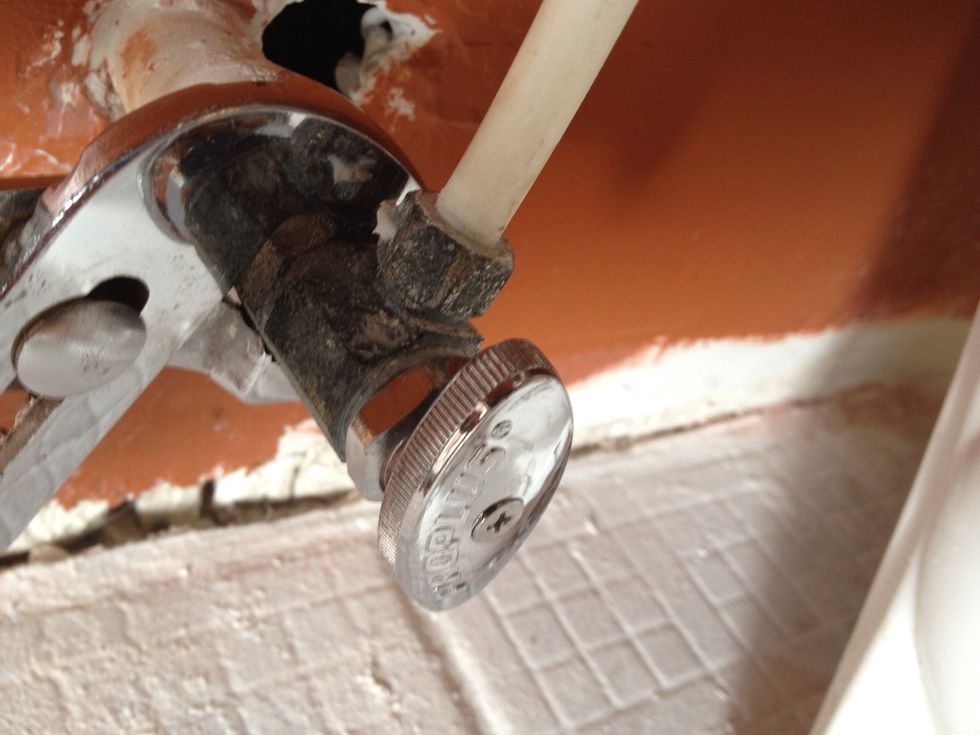 This is the finished non-leaking toilet valve. Notice the new plunger assembly in the old housing. Again, it wasn't necessary to change out the entire valve our case.