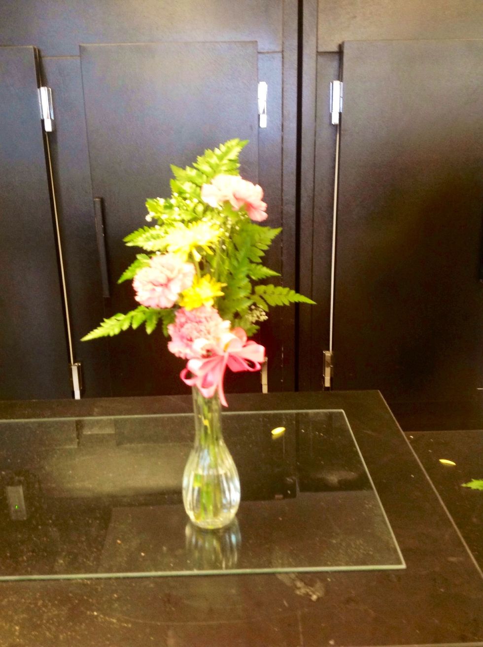 This is the finished product (bud vase) with the carnations, mums, gyp, and leatherleaf put into one to create the final product. The goal of this arrangement = achieve proper proportion and unity.
